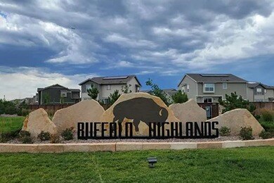 new homes for sale in denver. A sign : "BUFFALO HIGHLANDS" with homes behind it. BUFFALO HIGHLANDS-Denver, CO