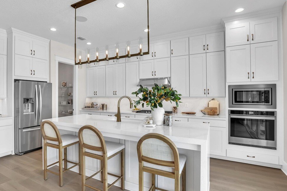 New Homes in St. Johns County, Florida. A beautiful kitchen with an island in a new home in Florida. Caspian.