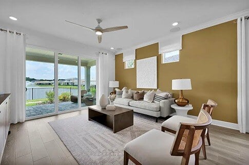 new homes in St. Augustine, FL. A living room with a dark accent wall. CONTOUR-St Augustine, FL