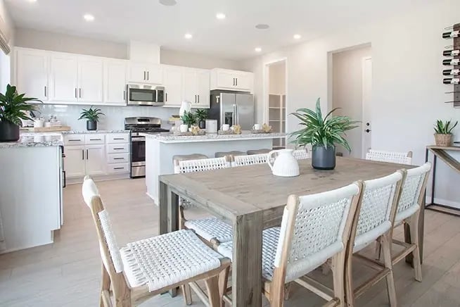 new homes in Antioch, CA. A white kitchen and dining room. PLAN 2-Antioch, CA