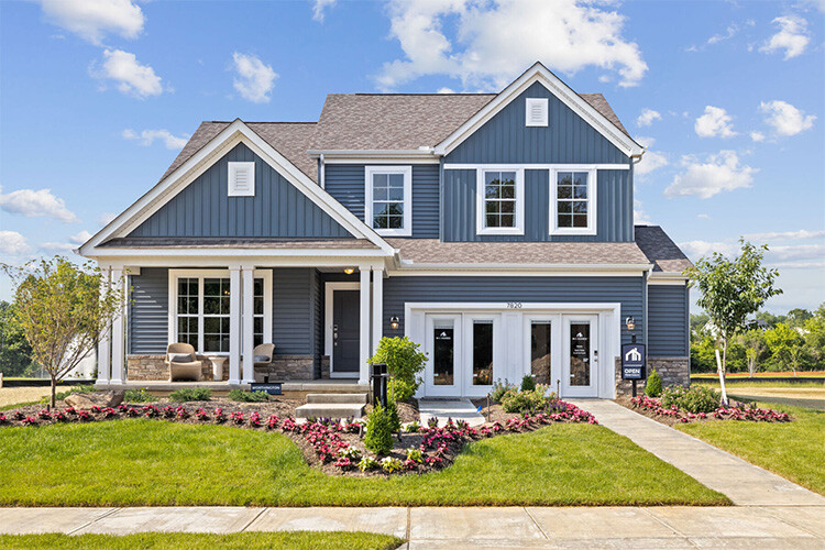 New build homes in Columbus. Spring Hill Farm-1. A house under a clear blue sky