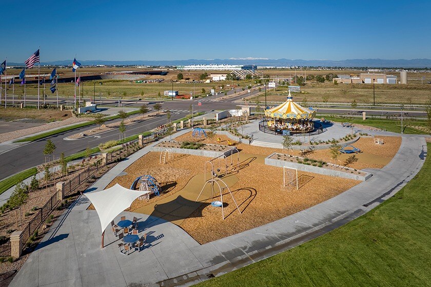 new homes for sale in denver. A community in Denver with a park and merry-go-round. The Aurora Highlands-Denver, CO