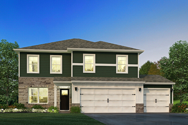 New build homes in Columbus. The Overlook. A house with the lights on at dusk.