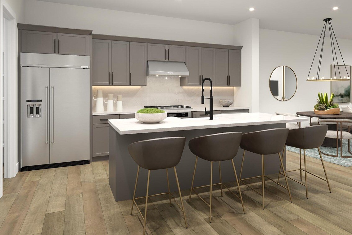  New Homes in San Francisco Bay Area. A kitchen with a fridge and island with stools. WILCOX-Bay Area, CA