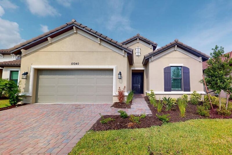 new homes in Port St. Lucie. A house with a new garden. Esplanade